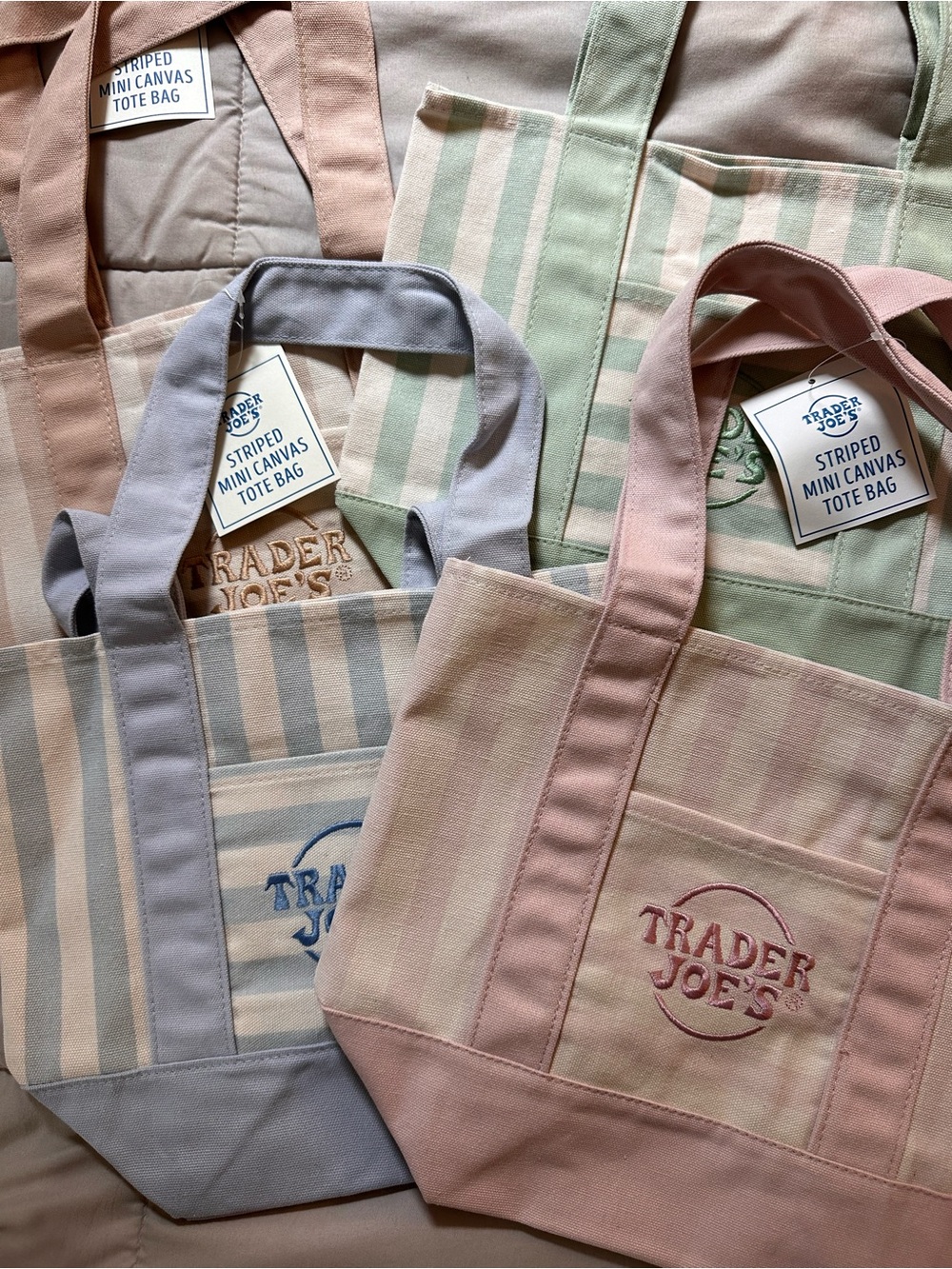 4 NWT Trader Joe’s mini tote bags, 1 of each color
